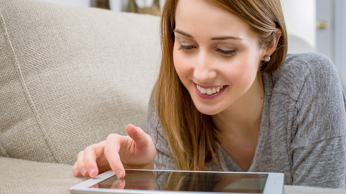 A happy lady using her tablet, no problems.